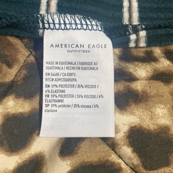 this is a very cute cropped green, striped American eagle shirt. - Picture 4 of 4